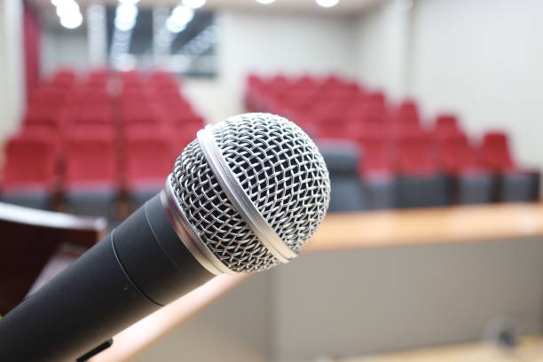 istock Lecture hall, Empty university classroom with two blocks of chairs 807294938