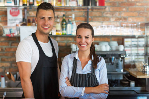 istock Young man and woman working at cafe 807295236