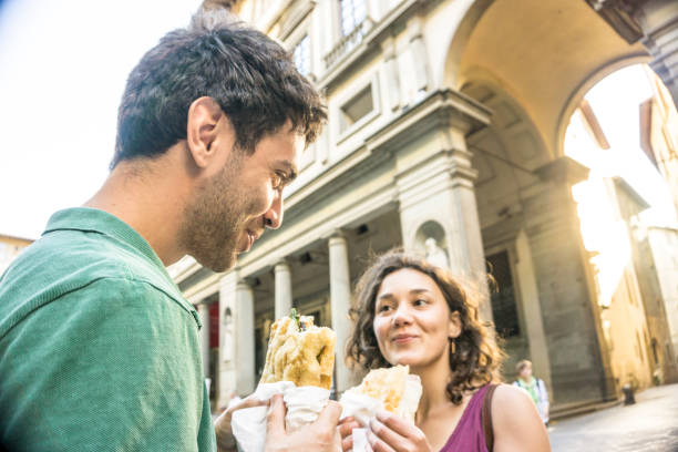 istock Young couple eating a sandwich 807298686