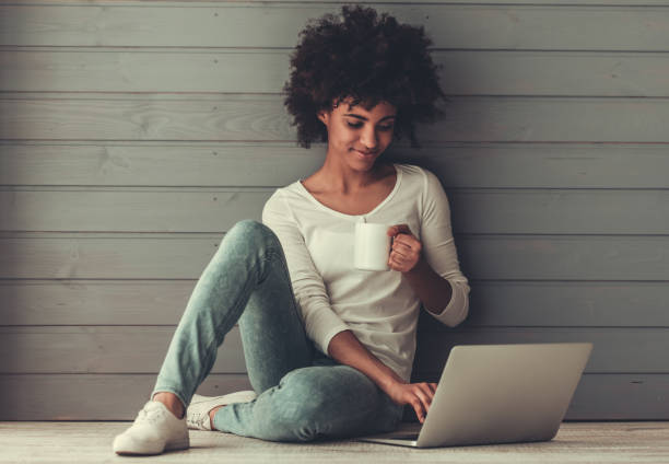 istock Afro American girl with gadget 807301120