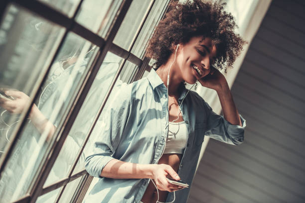 istock Afro American girl with gadget 807301612