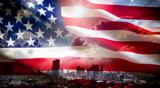 istock U.S.A. flag on city under sunlight background 807301956