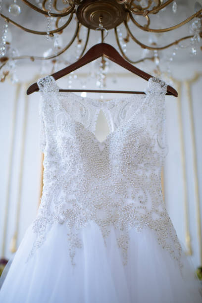 istock Beautiful white wedding dress for bride indoors 807308250
