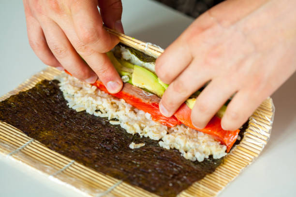 istock Preparation of sushi rolls 807313570