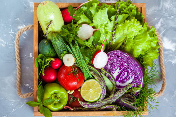 istock Summer vegetables in a wooden box. 807322080