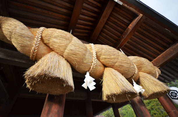 Sacred Straw Rope in front of the Prayer Hall of Izumo-taisha Sacred Straw Rope in front of the Prayer Hall of Izumo-taisha , Shimane Prefecture, Japan shrine stock pictures, royalty-free photos & images
