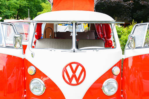 1950s Volkswagen Transporter T1 campervan with open doors parked in a park. The Volkswagen Transporter is a popular van to use as a camper and was delivered originally as a camper van, but many have been converted later. The car is on display during the 2016 Classic Days at Schloss Dyk in Juchen, Germany.