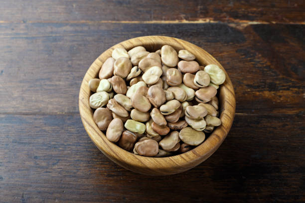 istock broad beans in a wooden bowl 807340526