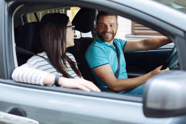 istock Happy couple sitting in their new car 807340712