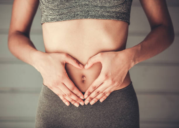 kuvapankkikuvat ja rojaltivapaat kuvat aiheesta afro amerikkalainen tyttö urheilua - stomach