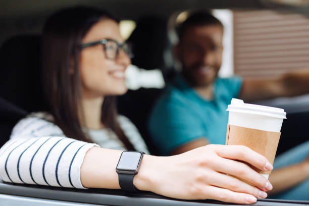 Neat female hands holding a cup of coffee