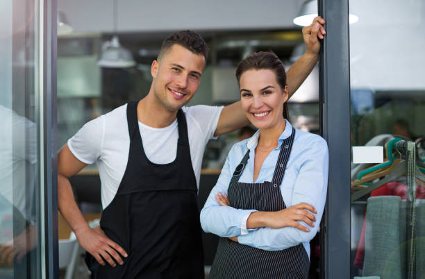 istock Young man and woman working at cafe 807364192