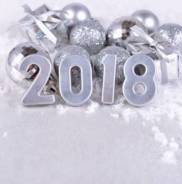 istock 2018 year silver figures and silvery Christmas decorations 807378662