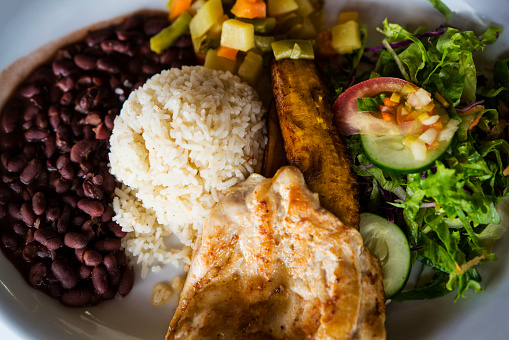 Casados is traditional meal in Costa Rica where rice and red or black bean are served side by side accompanied with ripe plantains or plantain chips, fried or scrambled eggs, cream or cheese, some sort meat or fish and of course corn tortillas. There are many combinations that come with rice and beans in Latin America like Gallo Pinto with mixed rice and beans, then casamiento in El Salvador, tacu tacu in Peru, calentado in Colombia, moros y cristianos in Cuba,