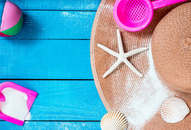istock summer season, beach on wooden, flat lay with copy space 807394994