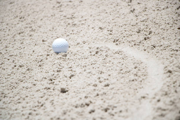 istock Golf Ball in Sand Trap 807395080
