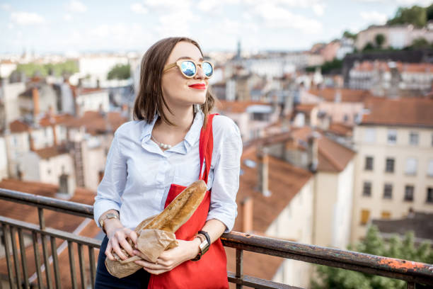 istock Woman with baguette in Lyon 807395946