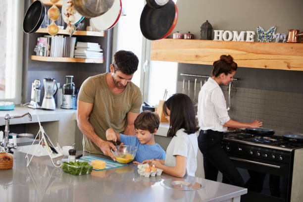 istock Family In Kitchen Making Morning Breakfast Together 807402056