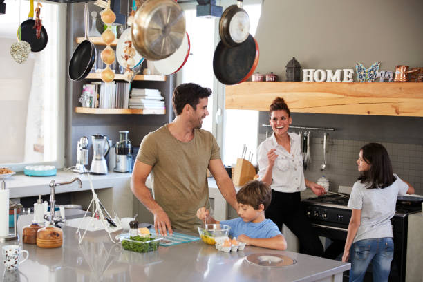 istock Family In Kitchen Making Morning Breakfast Together 807402174