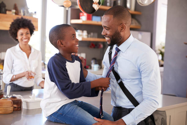 istock Father Saying Goodbye To Son As He Leaves For Work 807404798