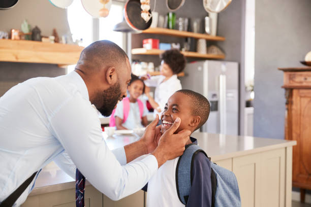 istock Father Saying Goodbye To Son As He Leaves For School 807405118