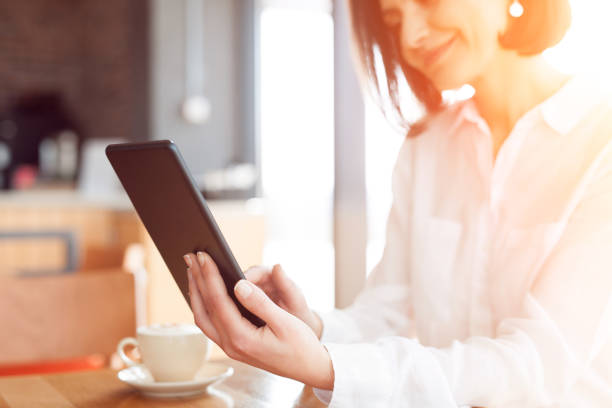 istock Adult woman posing with tablet 807405348