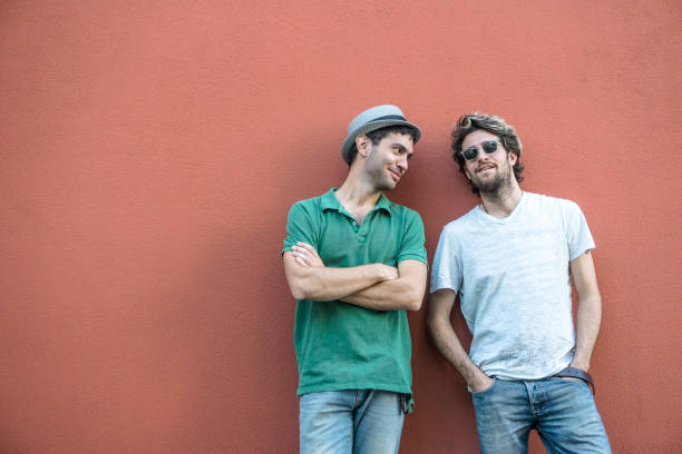 istock Gay couple on red background 807408748