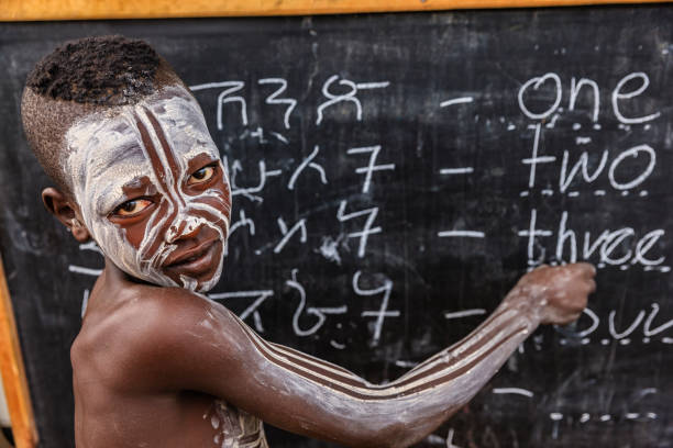 istock African young boy is learning  English language, Karo tribe 807408908