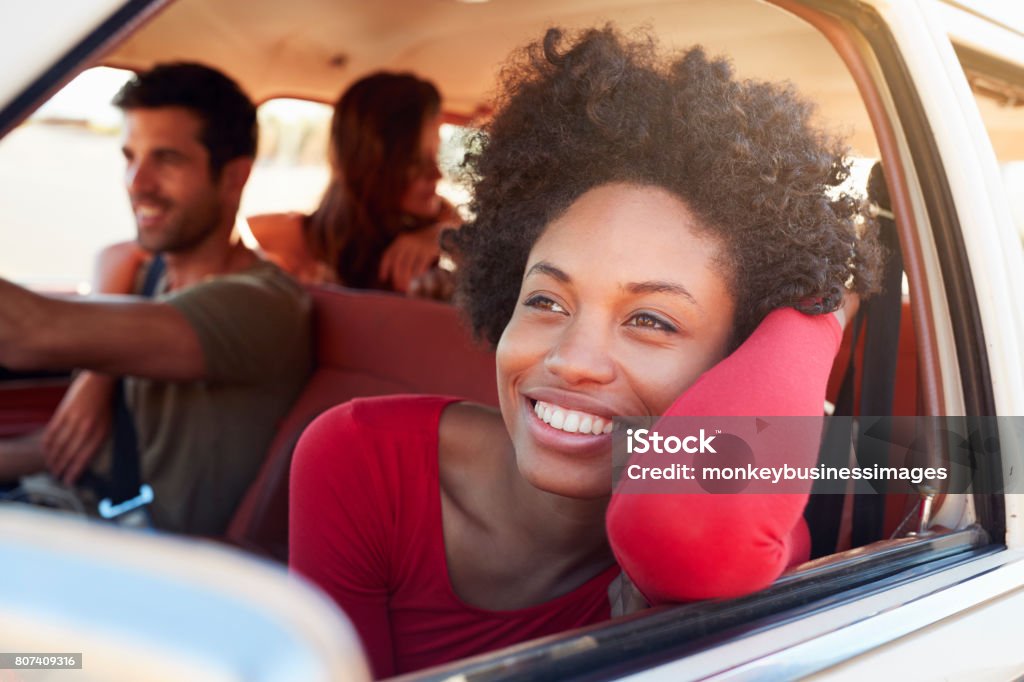 Group Of Friends Relaxing In Car During Road Trip Car Stock Photo