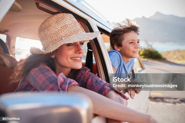 Mother And Children Relaxing In Car During Road Trip Stock Photo - Download Image Now
