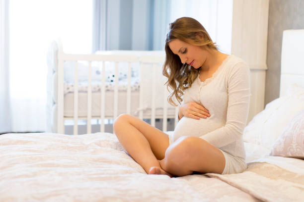 istock Pregnant woman on bed 807410038