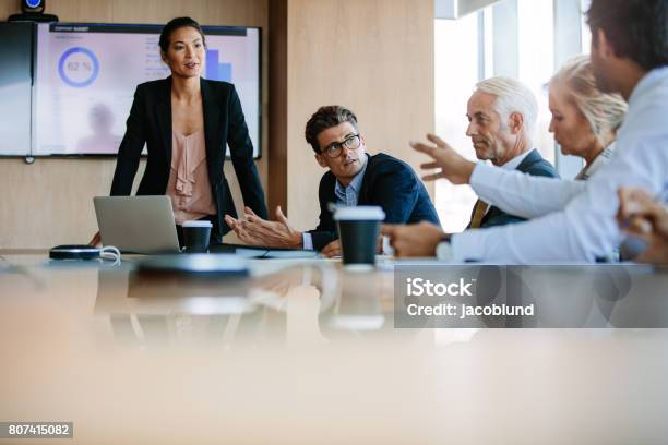 Diverse Business Group Having A Meeting In Boardroom Stock Photo - Download Image Now