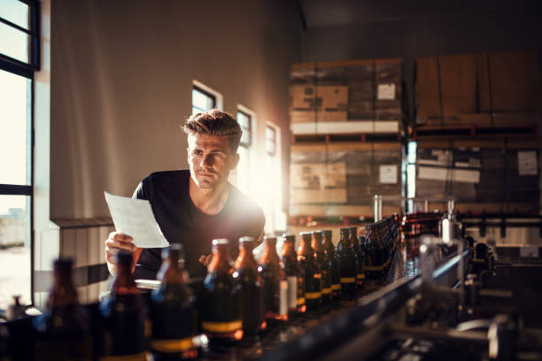 istock Worker checking the process on the production line in brewery factory 807415894