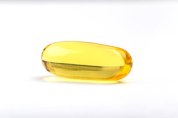 istock Close up a soft gel capsule on white background, natural fish oil supplements. 807420374