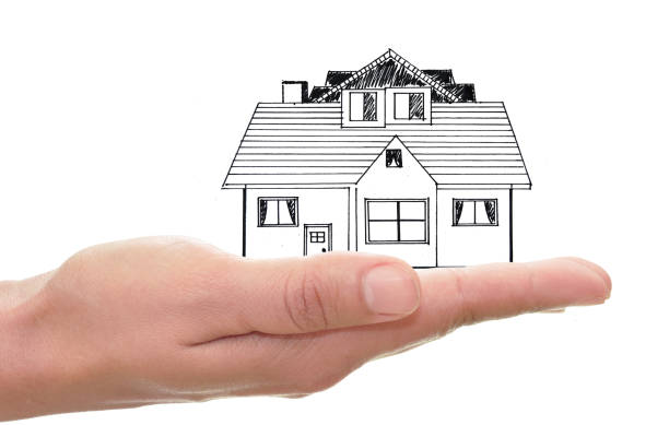 istock Hand holding a sketch of a house 807425112