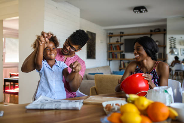 istock Family having fun in the kitchen while making cookies 807430658