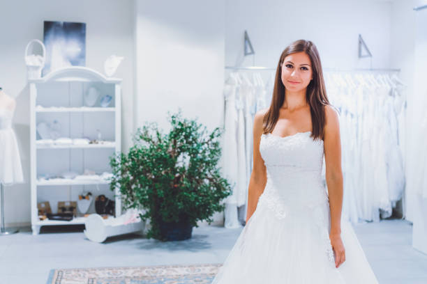istock Trying On A Wedding Dress 807434236