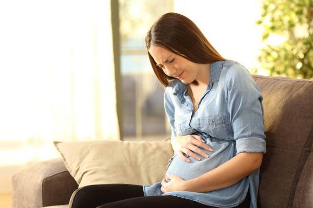 istock Pregnant woman suffering belly ache 807435072