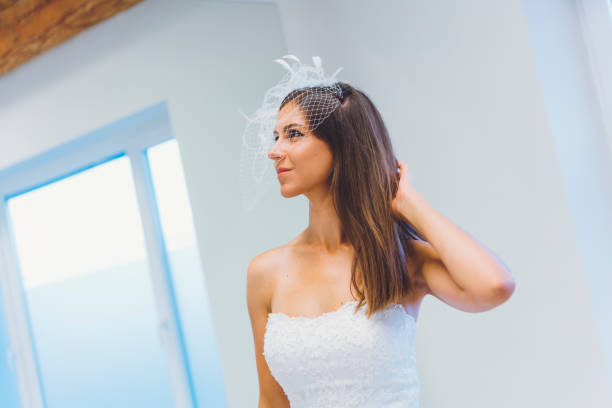 istock Trying On A Wedding Dress 807443024