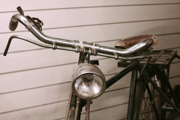 istock Old bicycle parking near wooden wall 807443038