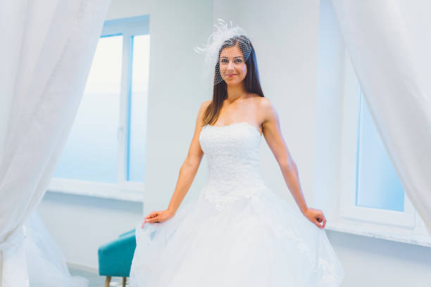 istock Trying On A Wedding Dress 807443878