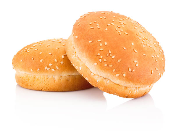 istock Two hamburger buns with sesame isolated on white background 807446612