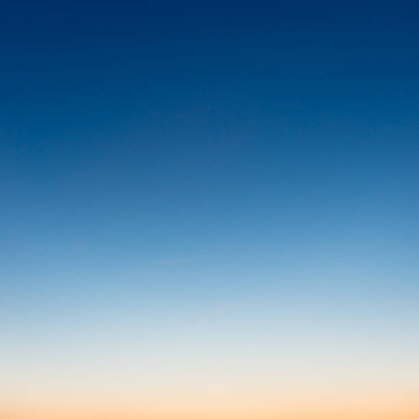 Graduated colours at dusk in photograph of sky A genuine photograph of an evening sky, cropped to a square format. dark blue sky stock pictures, royalty-free photos & images