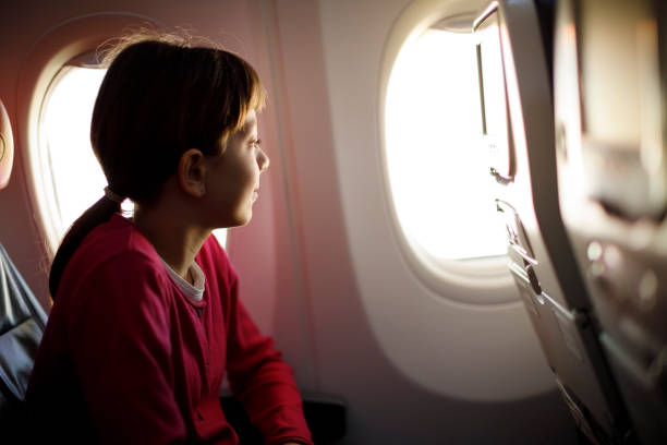 istock Girl in airplane 807451354