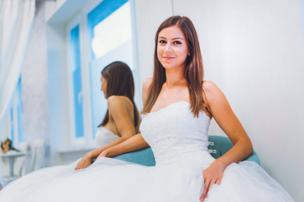 istock Trying On A Wedding Dress 807451734