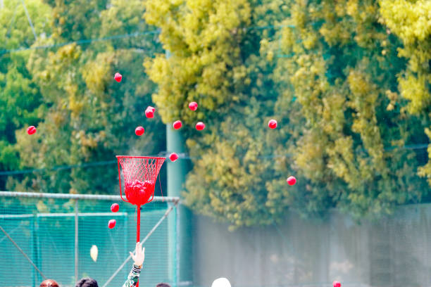 Male individual throwing a shot put in the track field events.