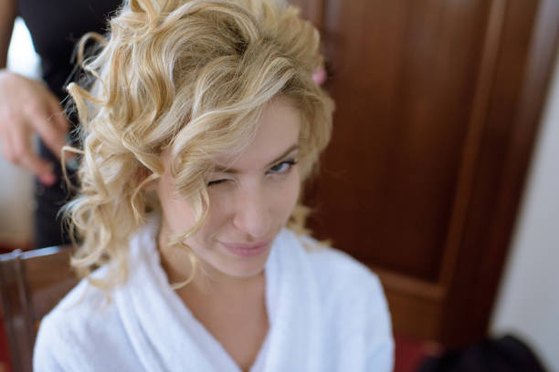 istock Wedding makeup artist making a make up for bride 807452694