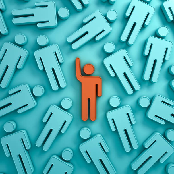 istock Stand out from the crowd and different creative idea concepts , One orange man raising his hand among other people on green pastel color background with shadows . 3D rendering 807452806