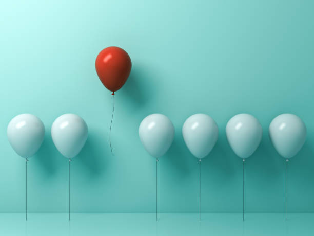istock Stand out from the crowd and different concept , One red balloon flying away from other white balloons on light green pastel color wall background with reflections and shadows . 3D rendering 807453094