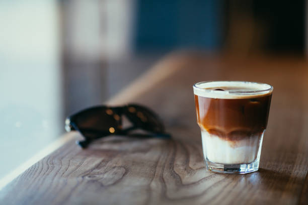 istock Iced latte on wooden counter 807463318